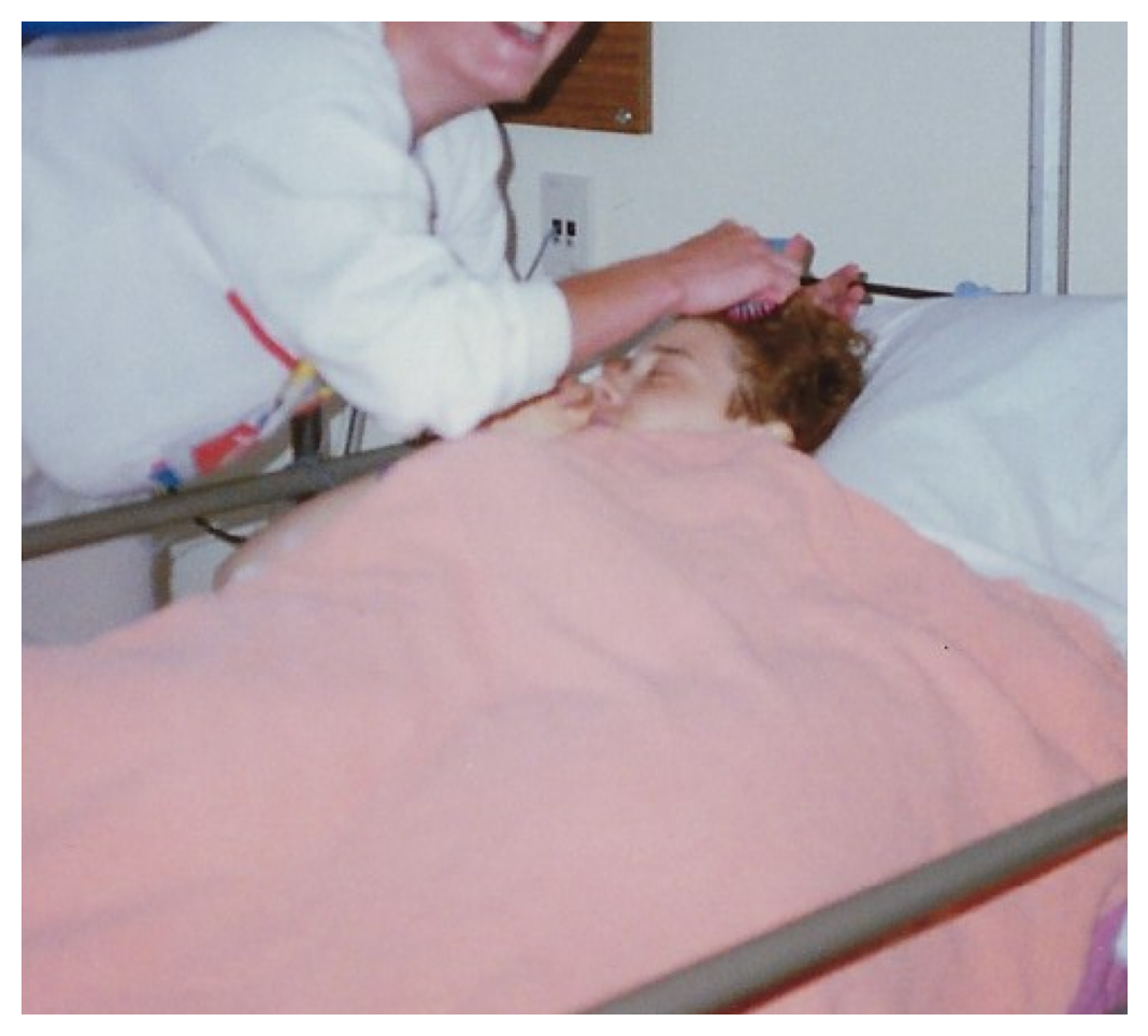 Young woman resting in a hospital bed under a pink blanket during her cancer diagnosis, reflecting a personal faith journey.