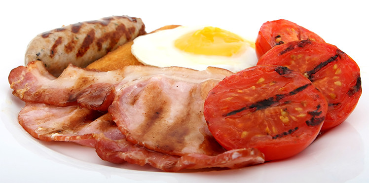 Sausage, ham and egg with tomatoes
